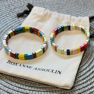 Set of 2 Roxanne Assoulin Enamel coated stretch bracelet with a gold tone logo